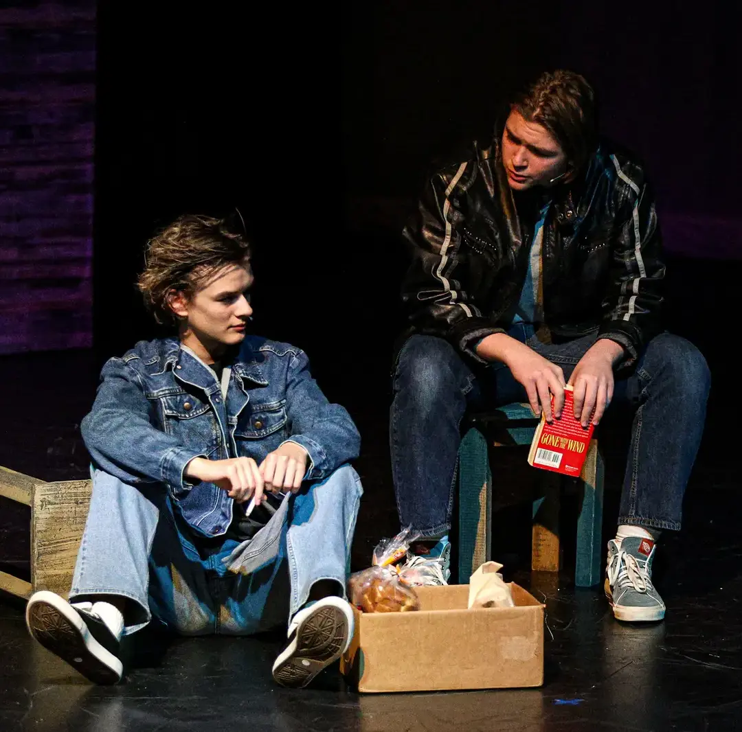 Student acting in production of Outsiders