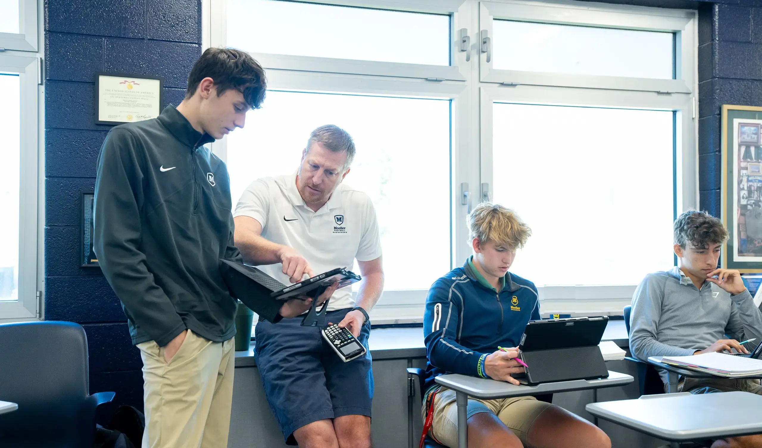 Math teacher working with student