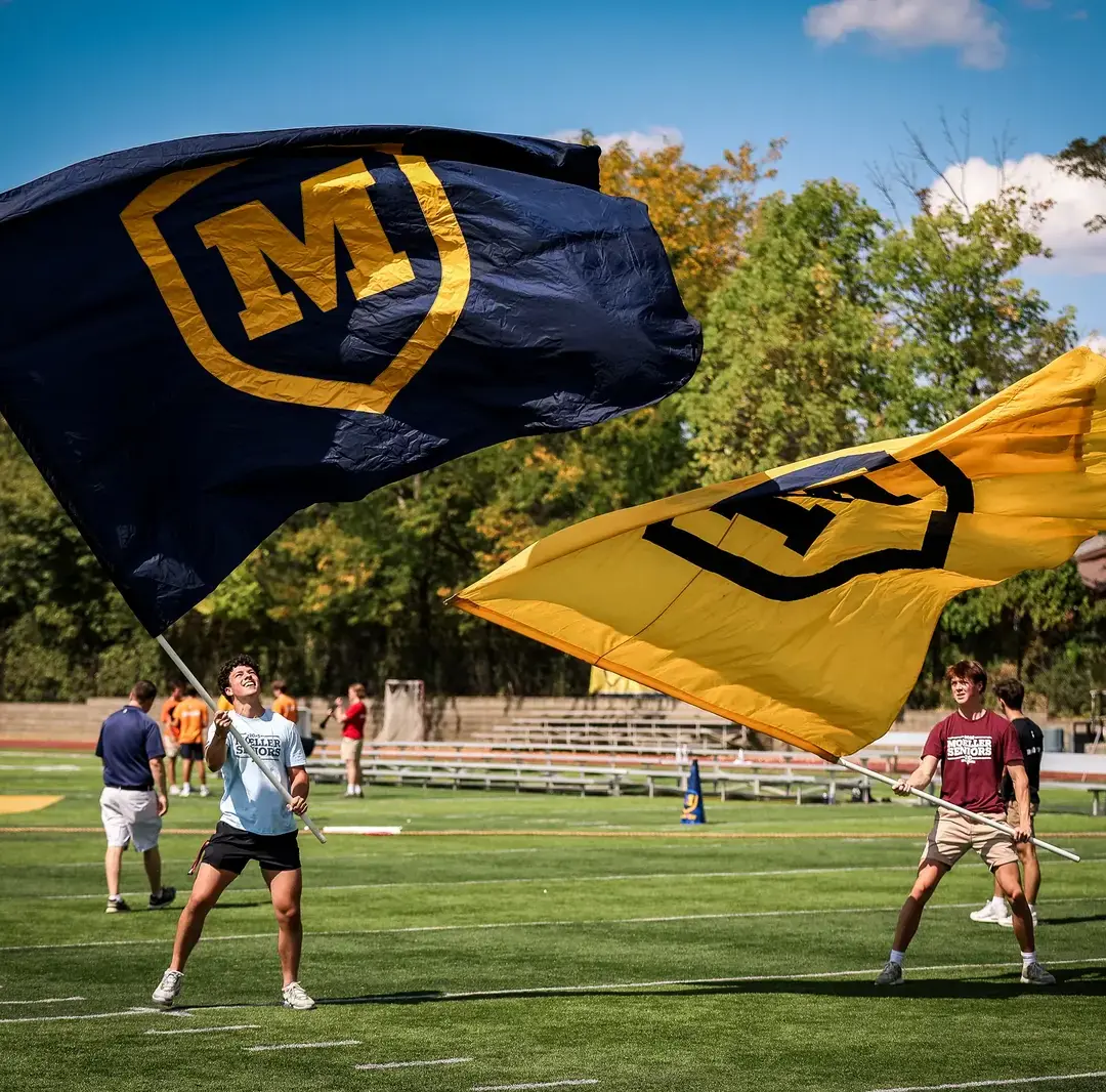 Students waving flags