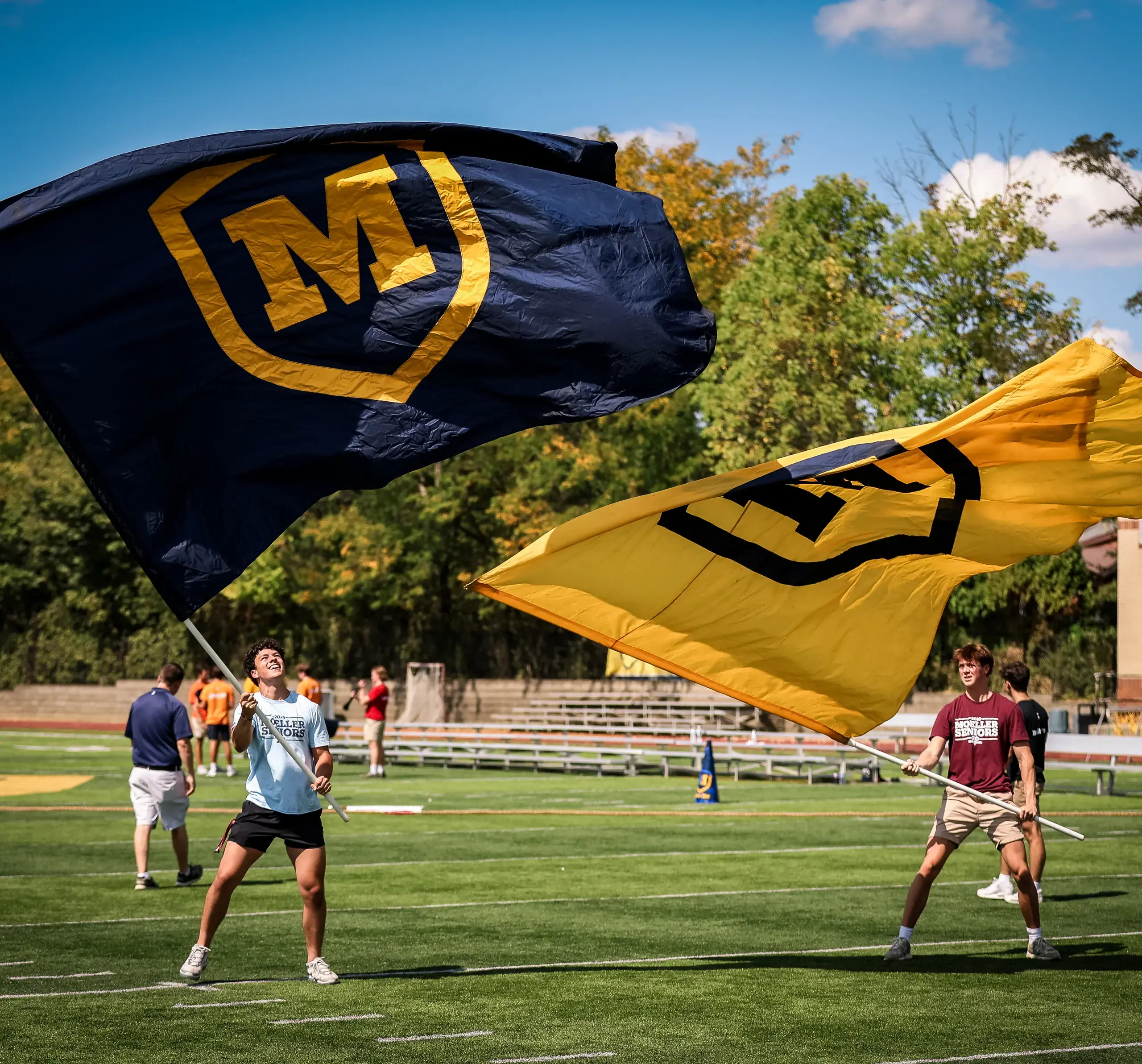 Moeller students waving the flags cheering on the team at MoeGate