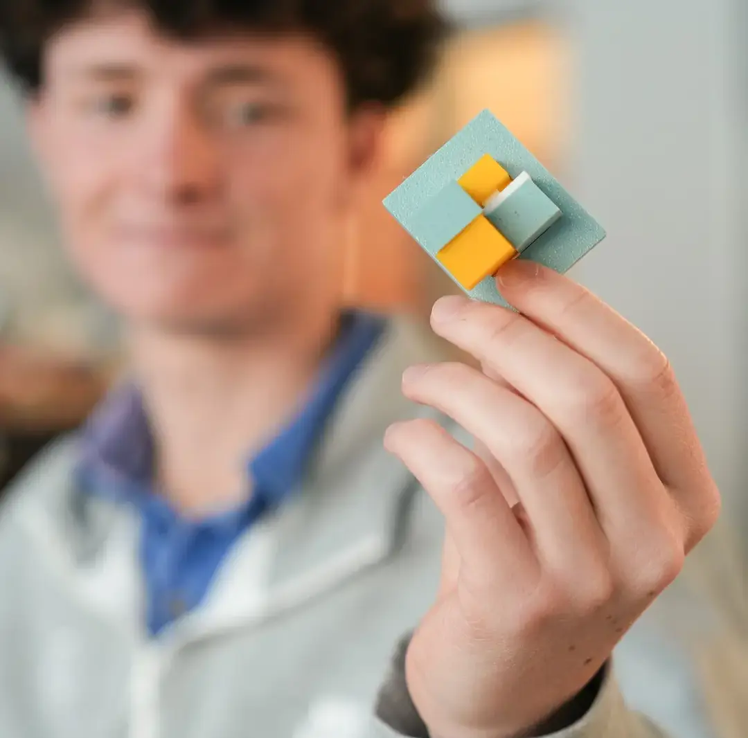 Moeller student showing off work in design build lab