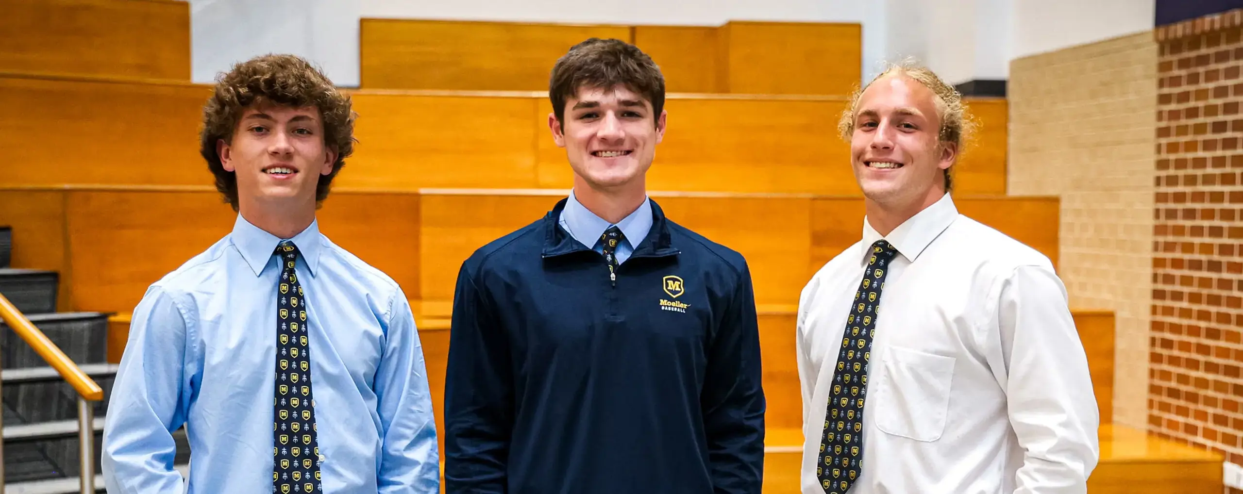 Three school captains in assembly hall